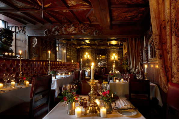 Wide shot of restaurant showing red and gold decor