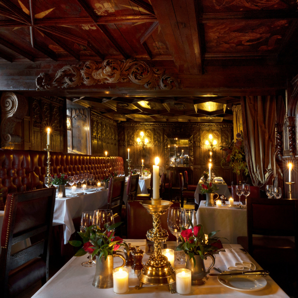 Wide shot of restaurant showing red and gold decor