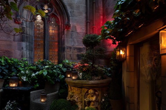 The Witchery Entrance with various plants and flowers around the entrance